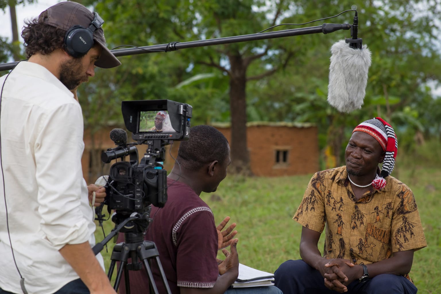 Documentary crew filming outdoor interview footage